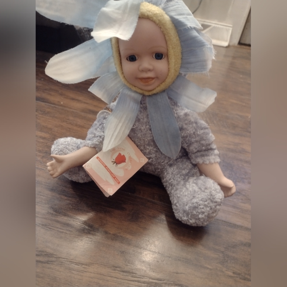 Adorable Blue Flower Porcelain Doll with Yellow Accents Collectable.